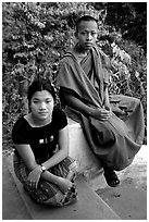 Buddhist novice monk and his sister. Luang Prabang, Laos (black and white)