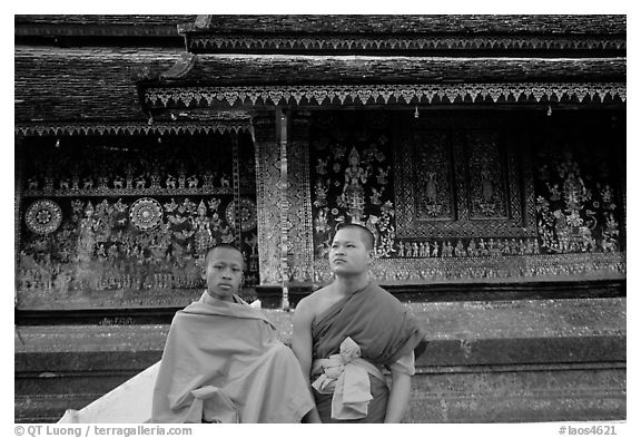 Two buddhist novice monks at Wat Xieng Thong. Luang Prabang, Laos (black and white)