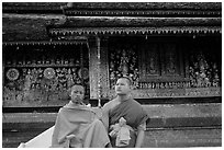 Two buddhist novice monks at Wat Xieng Thong. Luang Prabang, Laos (black and white)