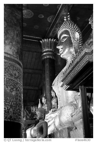 Buddha statues on altar, Wat Xieng Thong. Luang Prabang, Laos