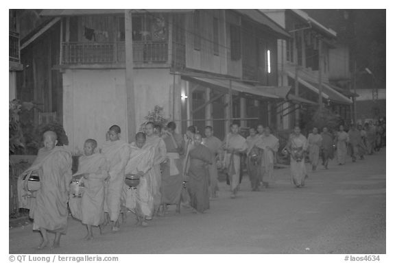 Morning alms procession of buddhist monks. Luang Prabang, Laos