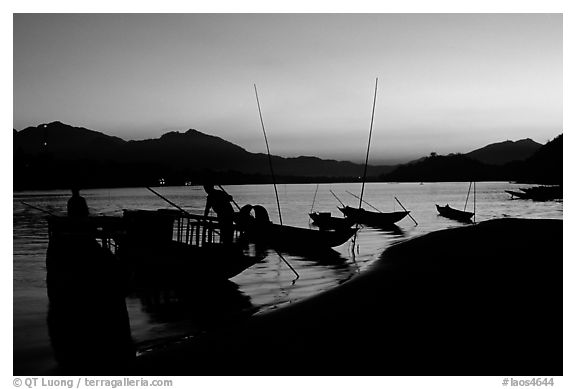 Boats, sunset on the Mekong river. Luang Prabang, Laos (black and white)