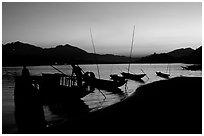 Boats, sunset on the Mekong river. Luang Prabang, Laos (black and white)