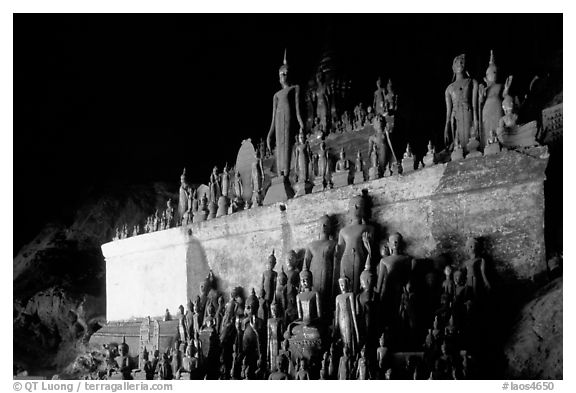 Buddha statues left by pilgrims in Pak Ou caves. Laos (black and white)