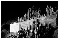 Buddha statues left by pilgrims in Pak Ou caves. Laos ( black and white)