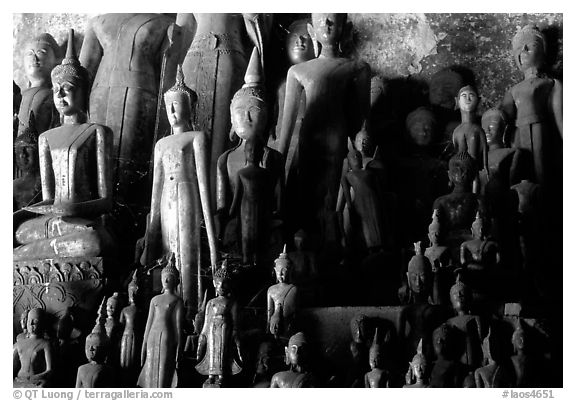 Lao style Buddha sculptures assembled over the centuries by local people, Pak Ou. Laos (black and white)