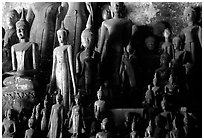 Lao style Buddha sculptures assembled over the centuries by local people, Pak Ou. Laos (black and white)