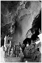 Novice Buddhist monk in  Tham Ting cave,  Pak Ou. Laos (black and white)