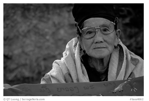 Older woman wears a mix of tribal and western garb. Luang Prabang, Laos