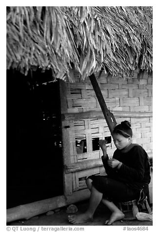Woman of the Lao Huay tribe in front of her hut,  Ban Nam Sang village. Laos (black and white)