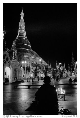 Praying at the wish-fullfilling place by night , Shwedagon Paya. Yangon, Myanmar (black and white)