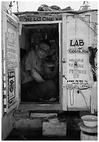 Man in one-room photo lab. Bagan, Myanmar ( black and white)