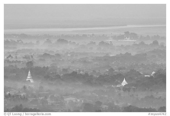 View from the hill through dawn mist. Mandalay, Myanmar