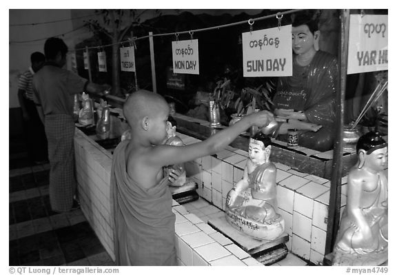 Novice offering Water at  Mahamuni Paya. Mandalay, Myanmar