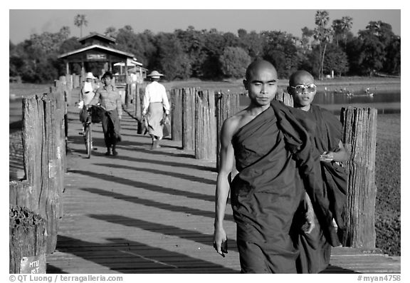 On the two century old U Bein bridge. Amarapura, Myanmar (black and white)