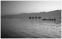 Long boat,  stilts huts, and mountains, sunrise. Inle Lake, Myanmar (black and white)