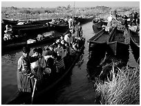 Children commuting to school on small boat. Inle Lake, Myanmar (black and white)