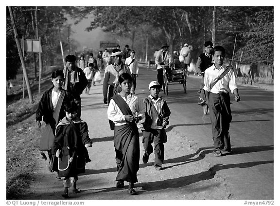 Walking on road near Swwenyaung. Shan state, Myanmar (black and white)