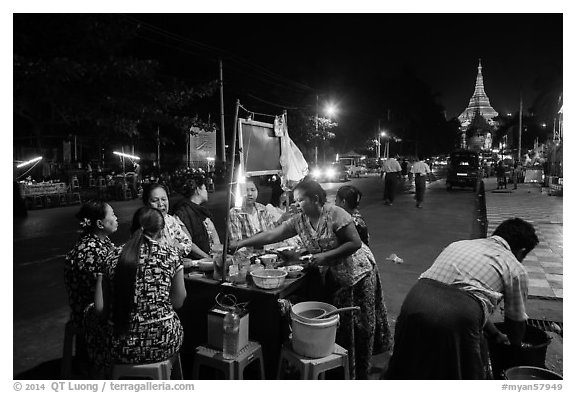 Streat food served at night, Shwedagon Pagoda in background. Yangon, Myanmar (black and white)