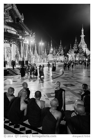 Monks, Terrace and Naungdawgyi (Elder Brother) Pagoda at night, Shwedagon Pagoda. Yangon, Myanmar (black and white)