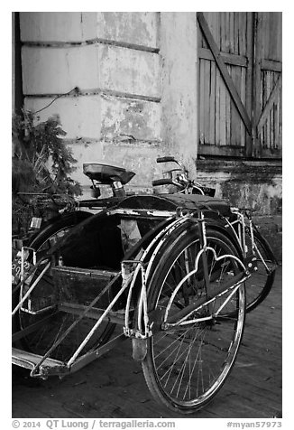 Sai kaa rickshaw and old facade. Yangon, Myanmar (black and white)