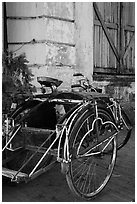 Sai kaa rickshaw and old facade. Yangon, Myanmar ( black and white)