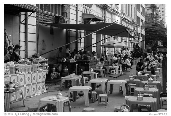 Outdoor eatery sitting on street. Yangon, Myanmar (black and white)