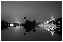 Shwedagon Pagoda and Karawek Hall reflected in Kandawgyi Lake. Yangon, Myanmar ( black and white)