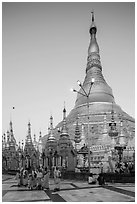 Nuns walking at the base of main chedi, Shwedagon Pagoda. Yangon, Myanmar ( black and white)