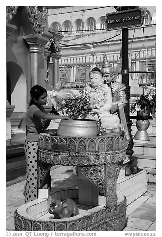 Woman worshipping at planetary post. Yangon, Myanmar (black and white)