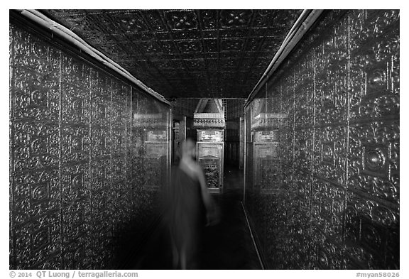 Monk inside gold-plated maze inside Botataung Pagoda. Yangon, Myanmar (black and white)