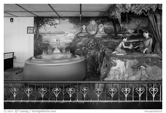 Scene of the life of lord Buddha and spinning pagoda model, Botataung Pagoda. Yangon, Myanmar (black and white)