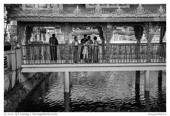 Family at turtle pond, Botataung Pagoda. Yangon, Myanmar (black and white)