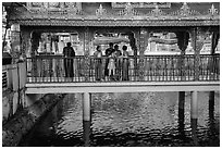 Family at turtle pond, Botataung Pagoda. Yangon, Myanmar ( black and white)