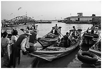 Passengers on oared water taxi crossing Yangon River. Yangon, Myanmar ( black and white)