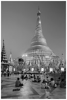 Praying from the Victory Ground, Shwedagon Pagoda, dusk. Yangon, Myanmar ( black and white)