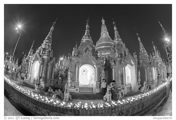 Oil lamps and stupas at dusk, Shwedagon Pagoda. Yangon, Myanmar (black and white)