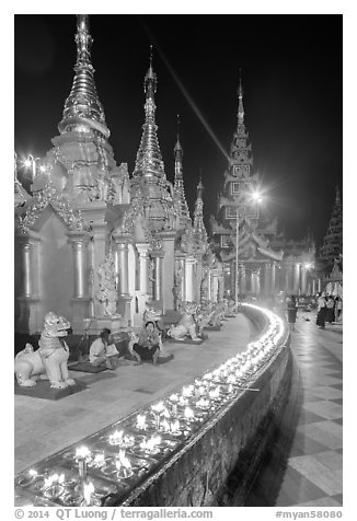 Oil lamps, stupas and shrines at night, Shwedagon Pagoda. Yangon, Myanmar (black and white)