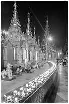 Oil lamps, stupas and shrines at night, Shwedagon Pagoda. Yangon, Myanmar ( black and white)