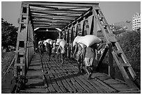 Workers unload bags of rice, Sinodan pier. Yangon, Myanmar ( black and white)