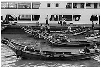 Long-tail boats and ferry, Sinodan pier. Yangon, Myanmar ( black and white)