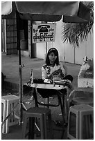 Phone booth operator. Yangon, Myanmar ( black and white)