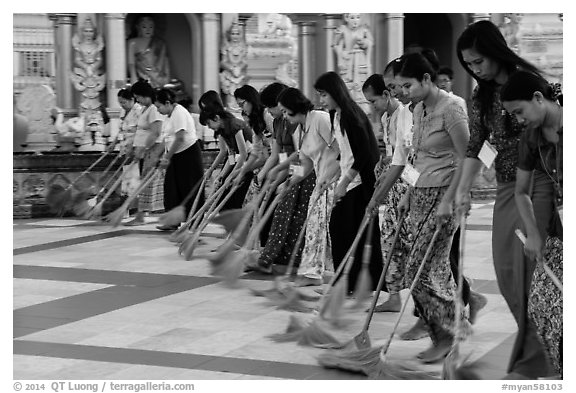 Women lining up to sweep the platform, Shwedagon Pagoda. Yangon, Myanmar (black and white)