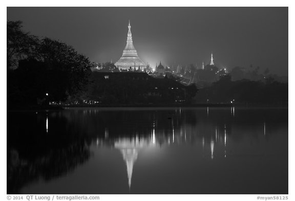Shwedagon Pagoda reflected in Royal (Kandawgyi) Lake at twilight. Yangon, Myanmar (black and white)