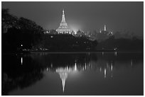 Shwedagon Pagoda reflected in Royal (Kandawgyi) Lake at twilight. Yangon, Myanmar ( black and white)