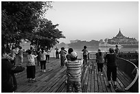 Group practising Tai Chi near Karawiek Hall at sunrise, Kandawgyi Lake Park. Yangon, Myanmar ( black and white)