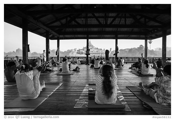 Women exercising in pavillion on Kandawgyi lake near Karawiek Hall. Yangon, Myanmar (black and white)
