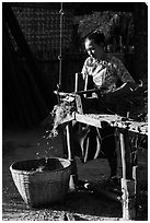 Villager processing harvest. Bagan, Myanmar ( black and white)