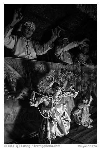 Marionettes handled by puppeteers. Bagan, Myanmar (black and white)
