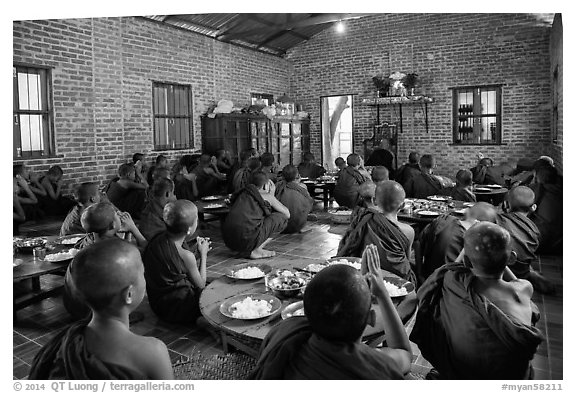 Novices in prayer before lunch, Nyaung U. Bagan, Myanmar (black and white)